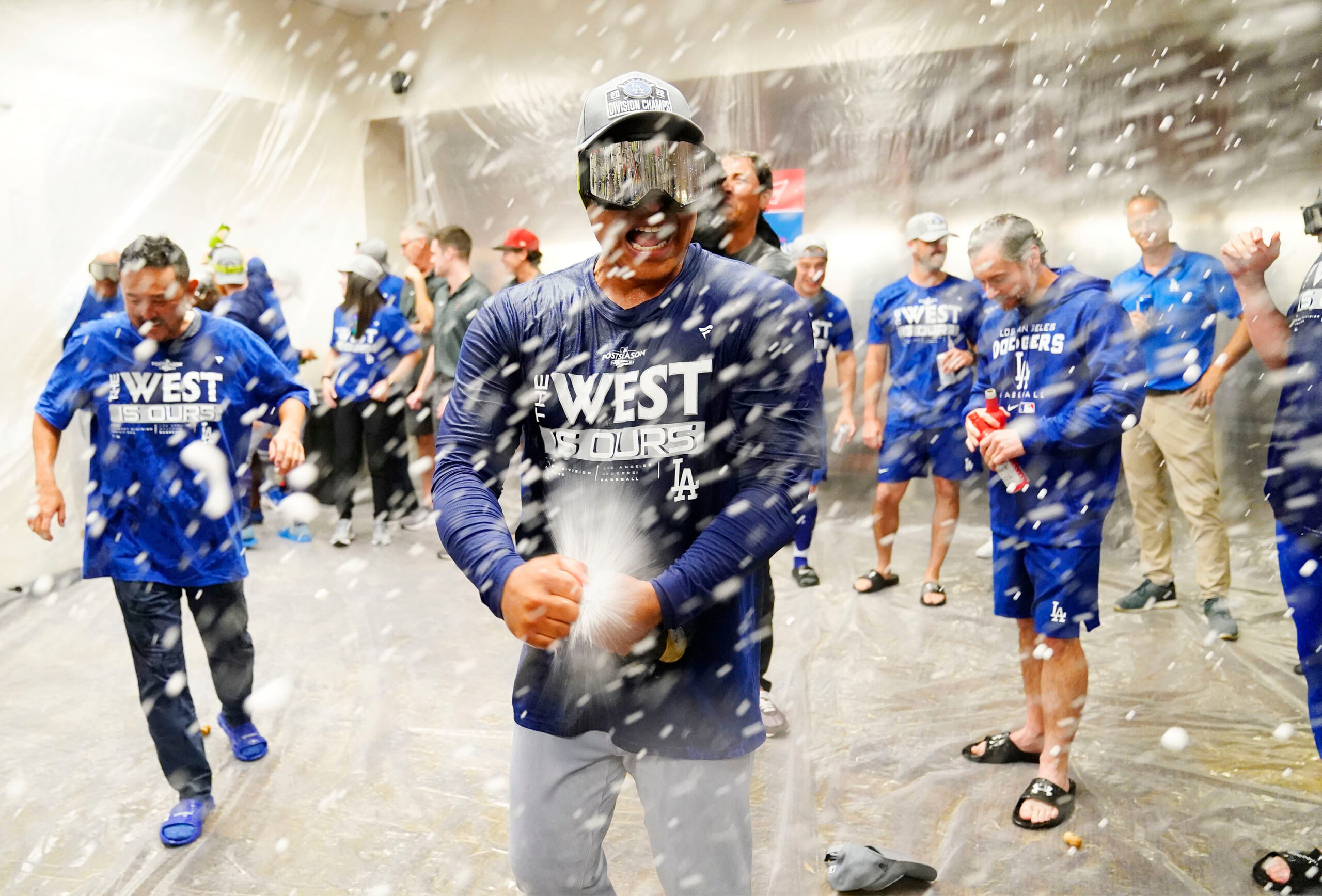 Los Angeles Dodgers manager Dave Roberts celebrates another NL West title with his players in the visitor clubhouse at Chase Field.