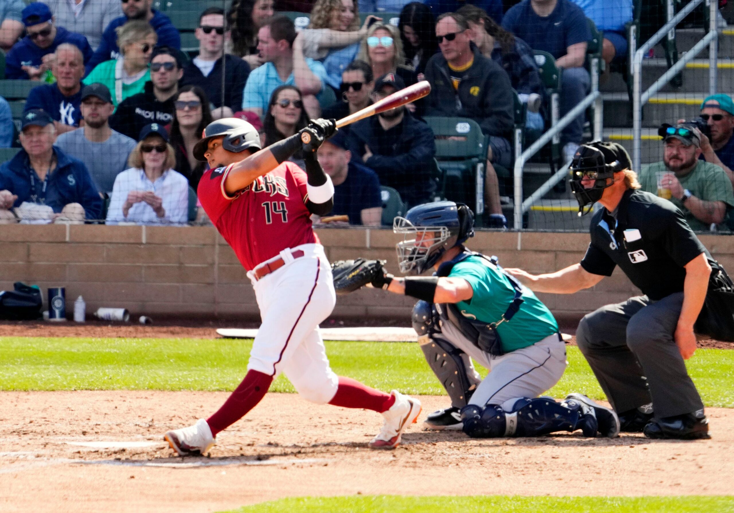Diamondbacks catcher Gabriel Moreno hits a single against the Seattle Mariners during a spring training game at Salt River Fields.