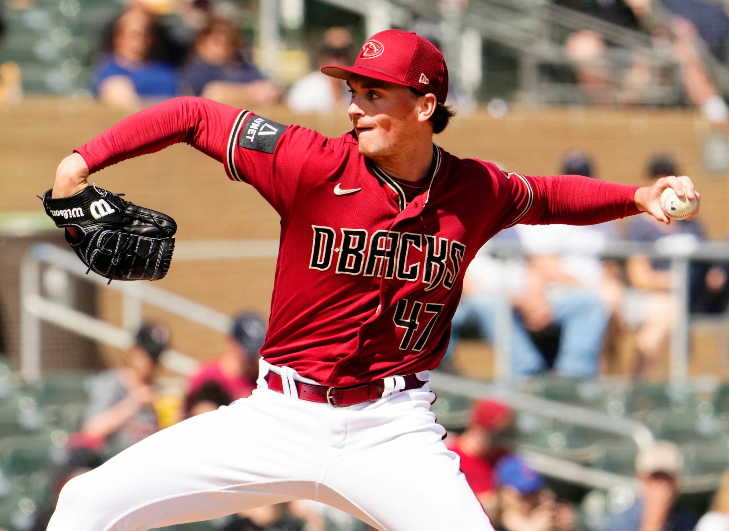 Diamondbacks starting pitcher Tommy Henry pitches against the Texas Rangers at Salt River Fields on March 8, 2023.